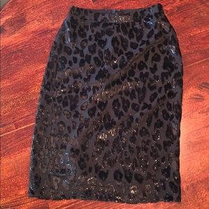 Medium length black leopard print skirt